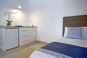 Postel nebo postele na pokoji v ubytování Los Milagros Hotel