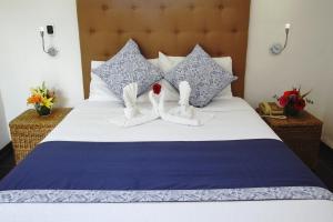 Postel nebo postele na pokoji v ubytování Los Milagros Hotel