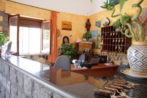 a home office with a desk and a vase at Hotel Diana in Ustica