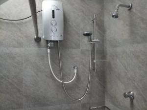 a shower in a bathroom with aitizer at Twin Villa 22 in Katugastota +79 photos