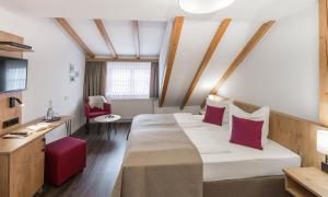 Postel nebo postele na pokoji v ubytování Hotel & Restaurant Lamm