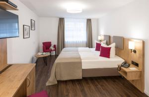 Postel nebo postele na pokoji v ubytování Hotel & Restaurant Lamm