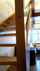 a staircase in a loft conversion with a stair railing at Apartamenty Przy Deptaku in Karpacz