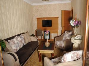 A seating area at Alfa Hotel