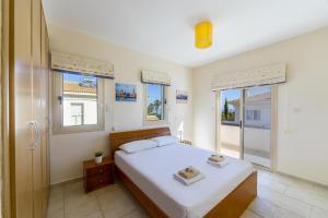 Postel nebo postele na pokoji v ubytování Villa Malama + 37 fotografií