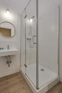 a bathroom with a shower and a sink at Apartamenty Mickiewicza in Katowice