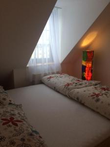 A bed or beds in a room at Tatry Fimali