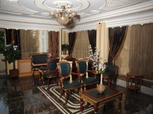 A seating area at Alfa Hotel