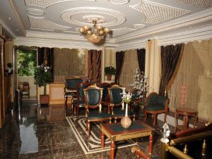A seating area at Alfa Hotel