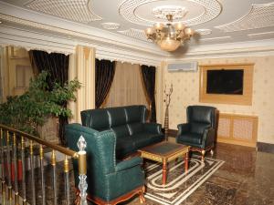 A seating area at Alfa Hotel