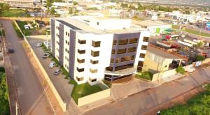 an overhead view of a large white building on a street at ALENCAR HOTEL in Barreiras