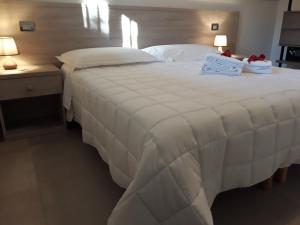 Ένα ή περισσότερα κρεβάτια σε δωμάτιο στο Cuoreverde Matera