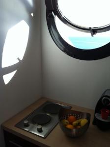 Kuchyň nebo kuchyňský kout v ubytování appartement vue mer el farniente