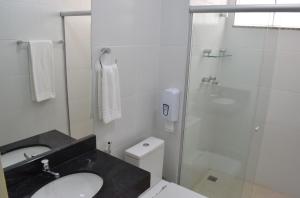 a bathroom with a shower and a sink and a toilet at ALENCAR HOTEL in Barreiras +25 photos