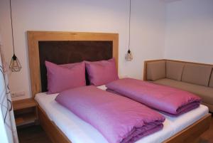 Ένα ή περισσότερα κρεβάτια σε δωμάτιο στο Die Atempause - appartements