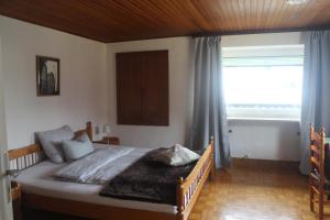 Postel nebo postele na pokoji v ubytování Gasthaus Schlossblick