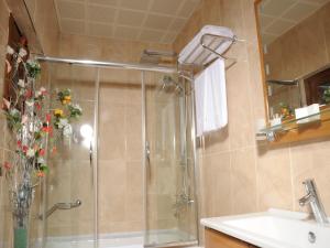 A bathroom at Alfa Hotel
