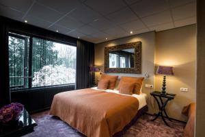 Postel nebo postele na pokoji v ubytování Hotel Sebastians