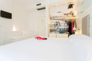 A bed or beds in a room at Hotel Majestic