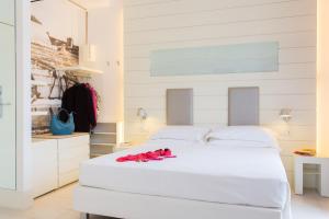 A bed or beds in a room at Hotel Majestic