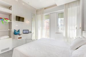 A bed or beds in a room at Hotel Majestic