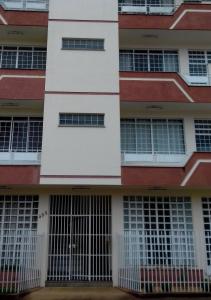 an external view of a building with barred windows at Canto dos Lagos in Piumhi