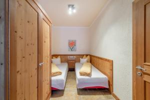 Ein Bett oder Betten in einem Zimmer der Unterkunft Linserhof Ferienappartements