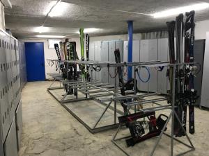a room with a bunch of skis on display at Gudauri Ski Studio in Gudauri
