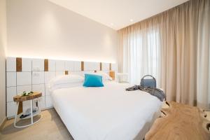 Posteľ alebo postele v izbe v ubytovaní Hotel Solemare
