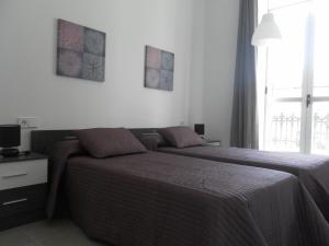 Posteľ alebo postele v izbe v ubytovaní Carrer de Dénia