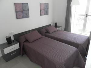 Posteľ alebo postele v izbe v ubytovaní Carrer de Dénia