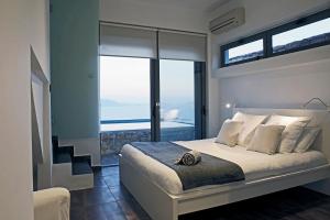 Postel nebo postele na pokoji v ubytování Seaview Salty villa + 14 fotografií