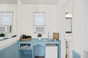 a blue desk in a kitchen with a sink at Sea Blue Hotel in Los Angeles