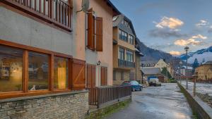 a street in a town with buildings and a mountain at Saplan Real Estate CASISH in Les