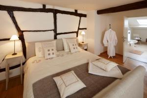 Postel nebo postele na pokoji v ubytování B&B Hof van Vervoering