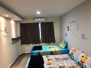 a childs bedroom with a bed and a window at Budget for 12 in Ipoh