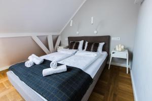 Posteľ alebo postele v izbe v ubytovaní Apartamenty Koci Ogon