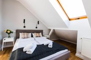 Posteľ alebo postele v izbe v ubytovaní Apartamenty Koci Ogon