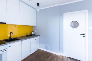 Kuchyňa alebo kuchynka v ubytovaní Apartamenty Koci Ogon