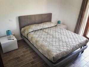 a bedroom with a large bed and a window at Lago Vivo in Barrea