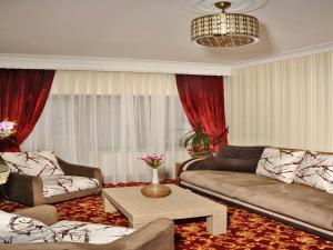 A seating area at Alfa Hotel