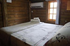 Postel nebo postele na pokoji v ubytování Mandala Chalés