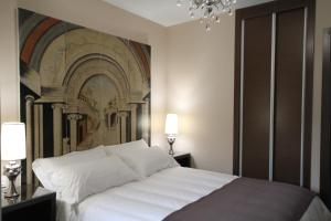 Posteľ alebo postele v izbe v ubytovaní Alvear Suites