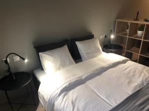 Postel nebo postele na pokoji v ubytování DISTRiCT 01-Luxury Urban Lofts