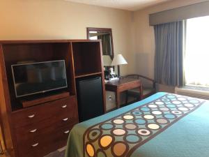 A television and/or entertainment centre at Super 8 by Wyndham Sacramento