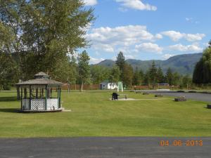 a park with a gazebo in the grass at Mountain Springs Motel & RV Park in Barrière