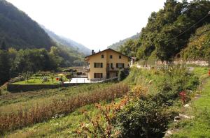 a house on the side of a mountain at Agriturismo La Via Del Sale in Pignone