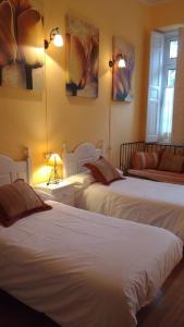 מיטה או מיטות בחדר ב-Hotel restaurante Parador de Felechosa