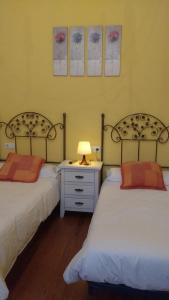 מיטה או מיטות בחדר ב-Hotel restaurante Parador de Felechosa