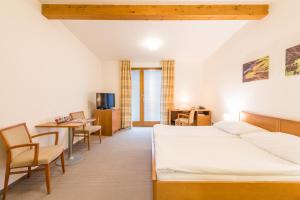 Postel nebo postele na pokoji v ubytování Hotel Kaskáda